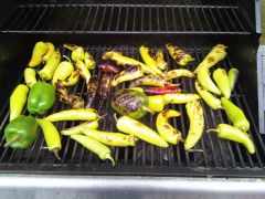 grill loaded with peppers, flipped