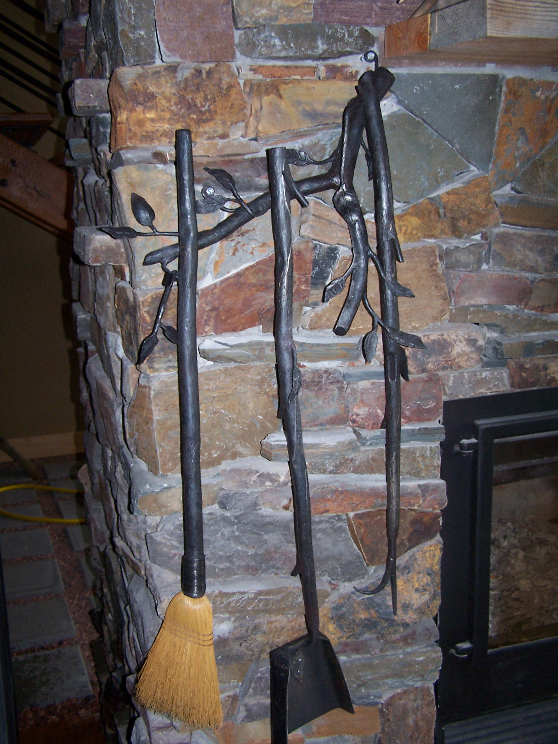 fireplace tools attached to fireplace