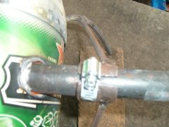 close up of burner clamp and  bracket