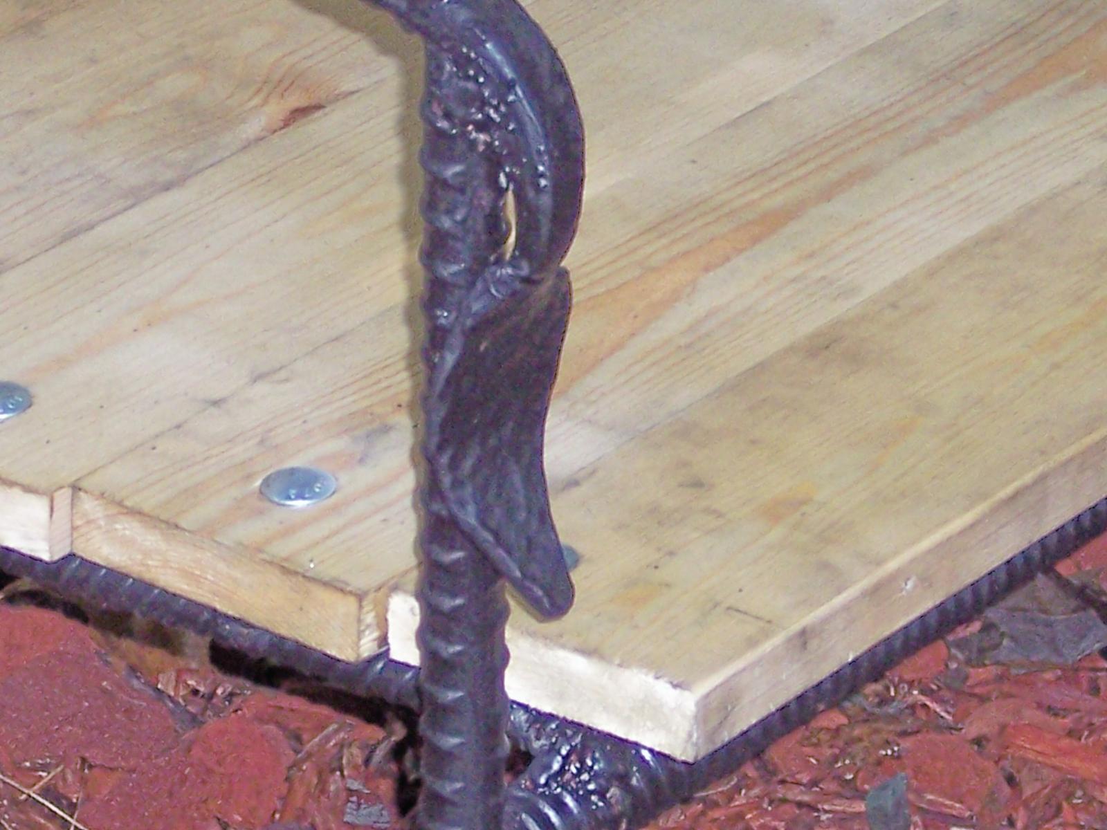 forged leaf on the bench arm rest