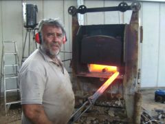moony  taking a stem blank out of the furnace