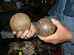 Two (balls)  globes in hand