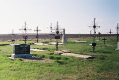 Another cemetery with wrought iron crosses