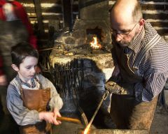 More information about "Me and my son at the forge."