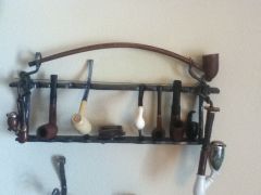 Hand forged pipe rack with pipes