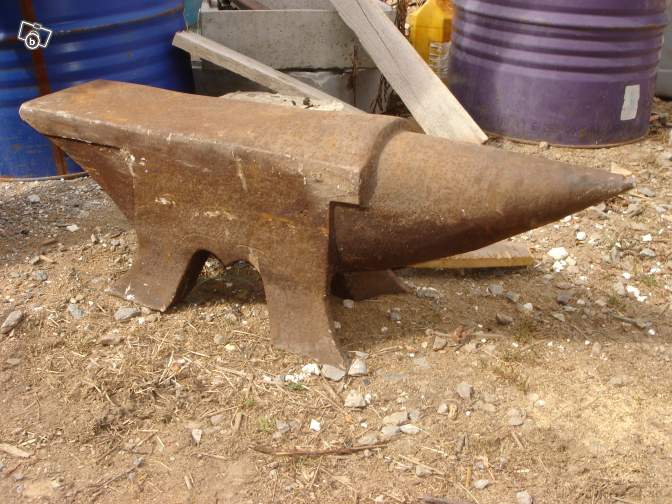 french pig anvil side view arched horn collar.jpg