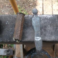 Head and torso forged from old chisel.